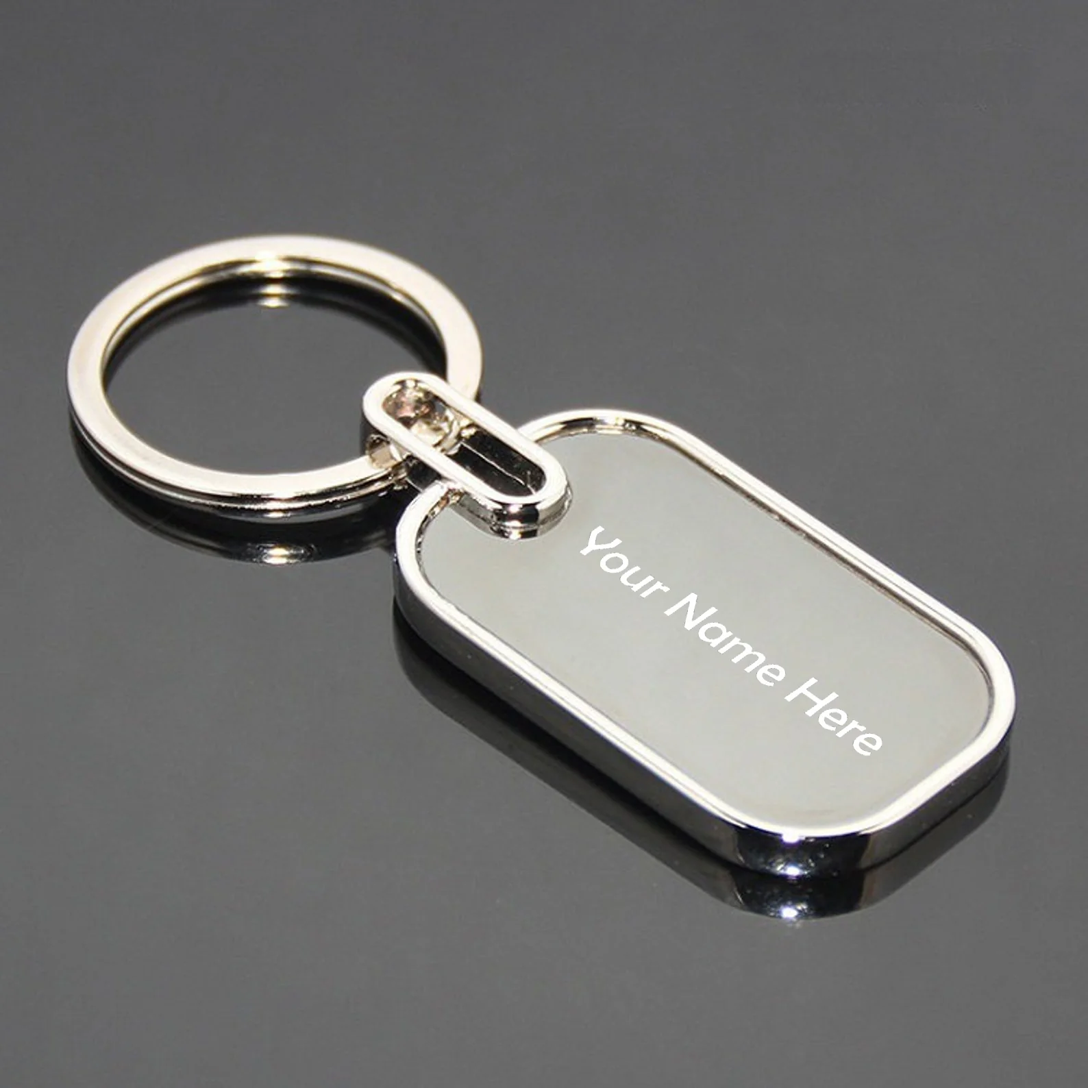 Personalised round stainless steel keychain engraved with a name