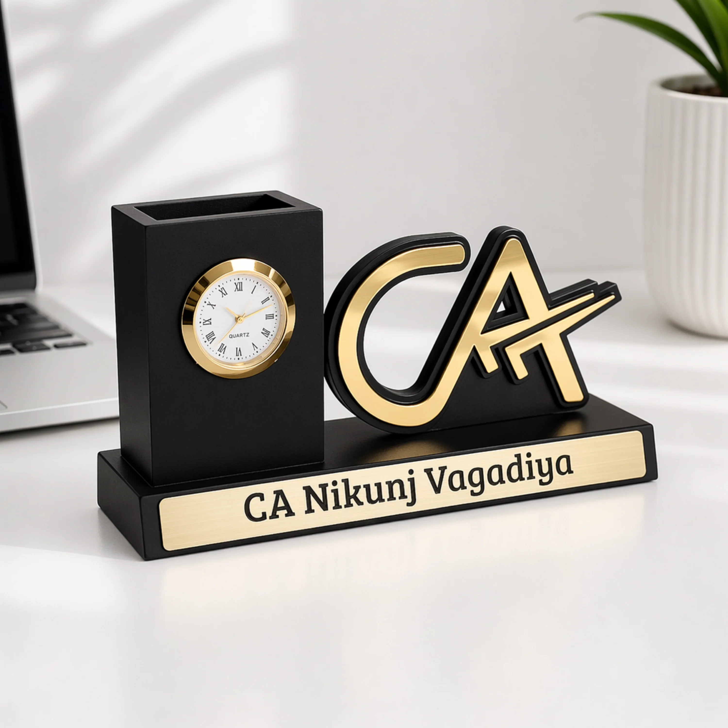 CA desk organiser in matte black and gold with clock, pen holder and CA emblem